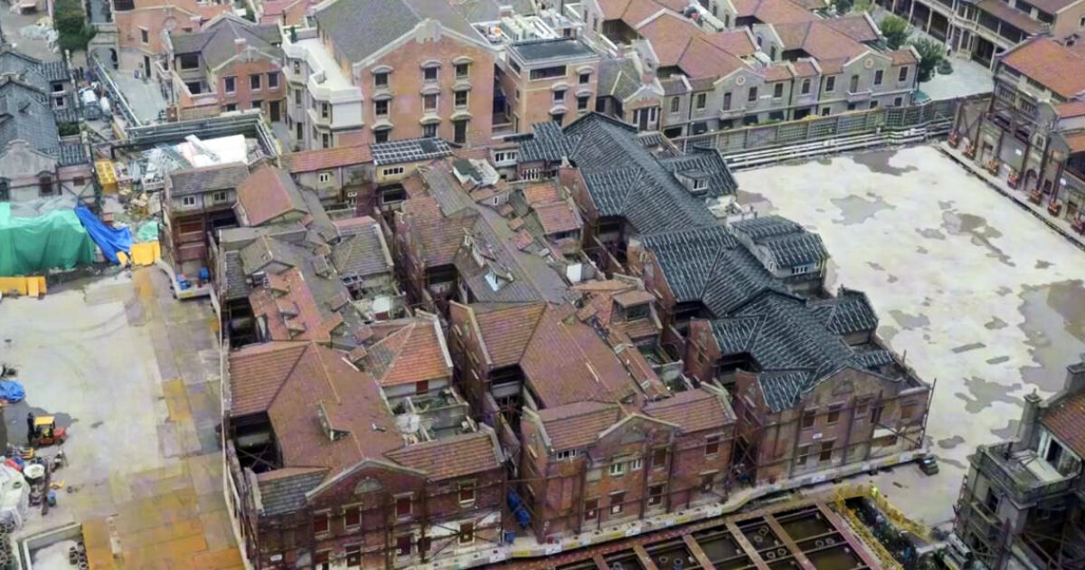 mini robots relocate an entire shikumen complex in shanghai, china