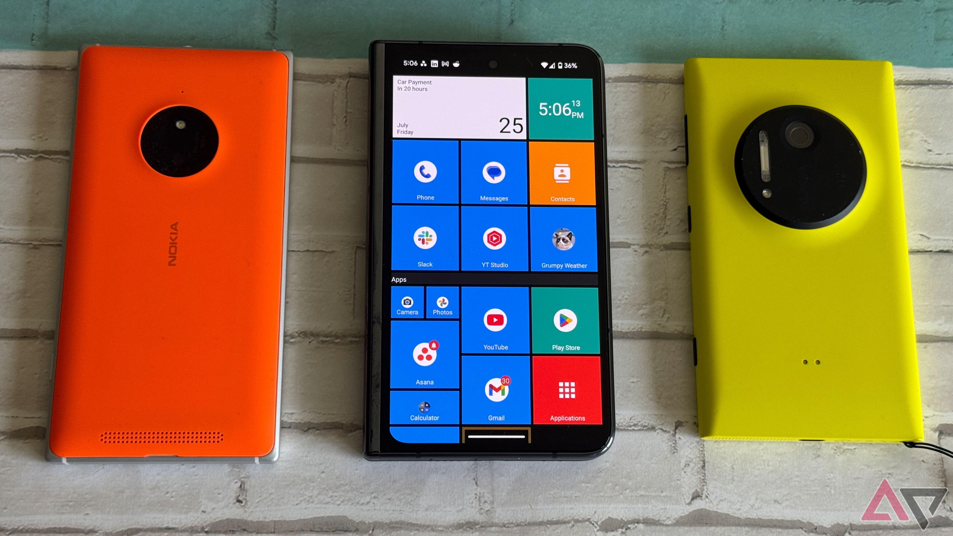 Google Pixel Fold with the Square Home launcher next to a Lumia 1020 and 830