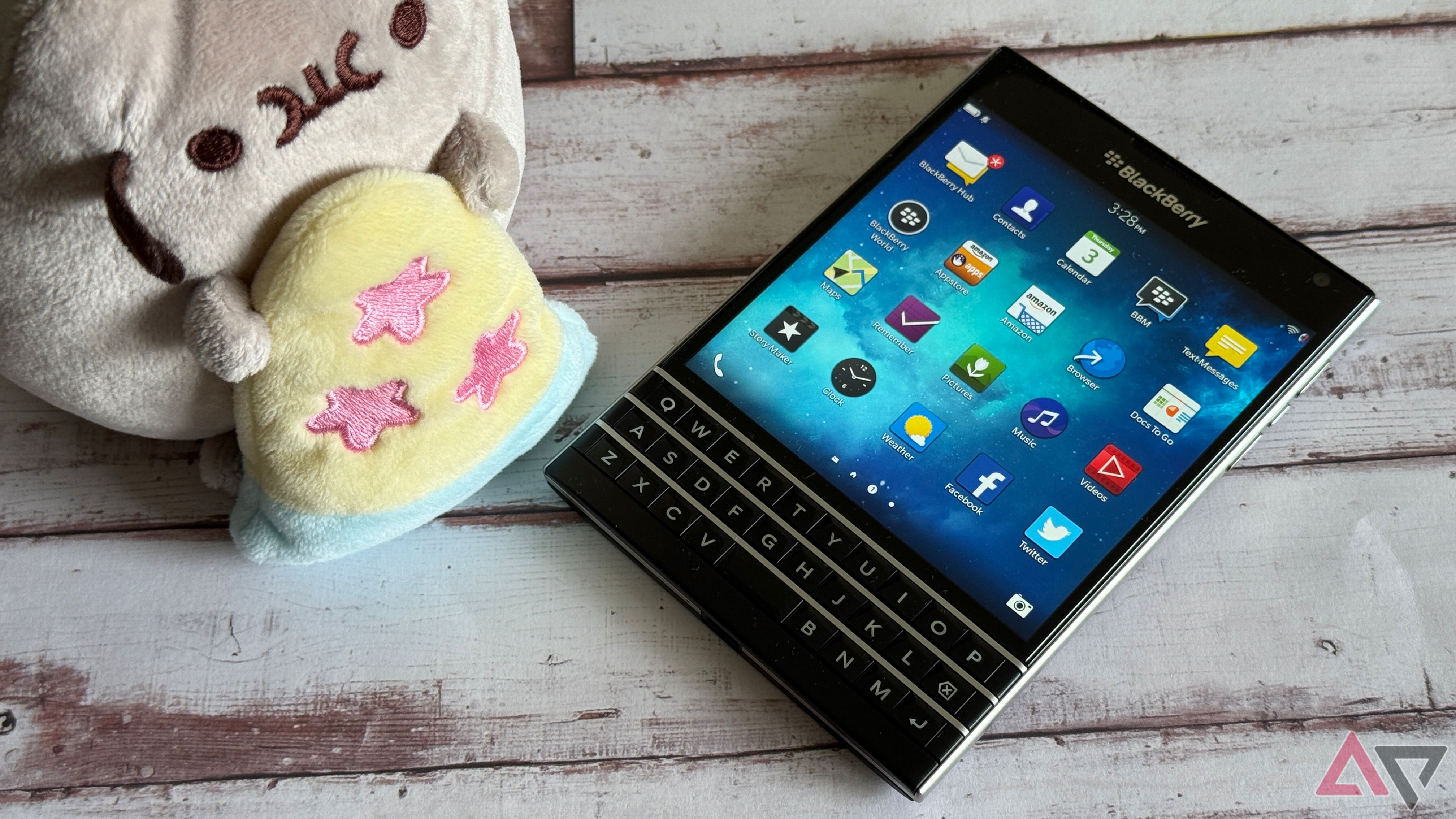 BlackBerry Passport sitting next to Pusheen