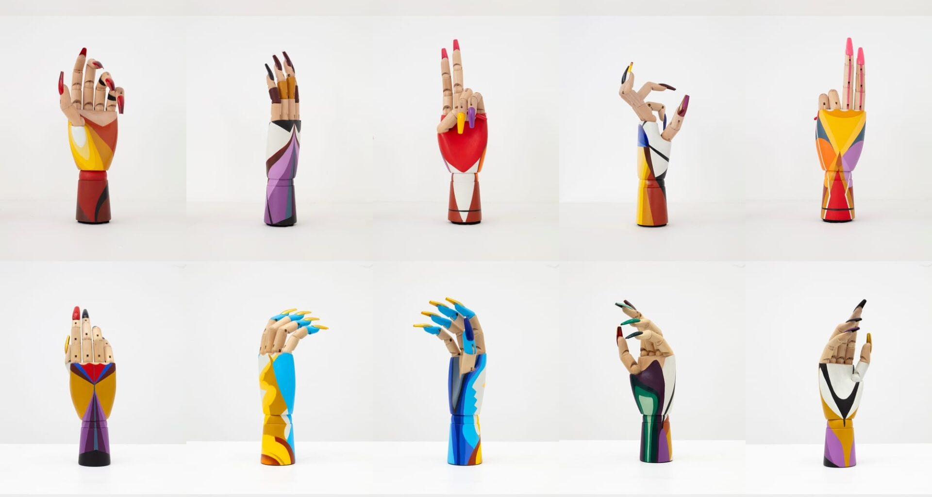 a grid of wooden hand mannequins painted with fake nails