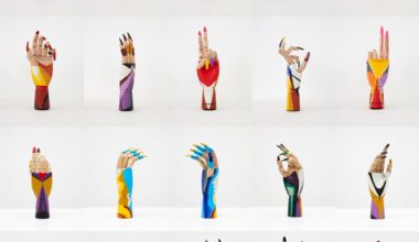 a grid of wooden hand mannequins painted with fake nails