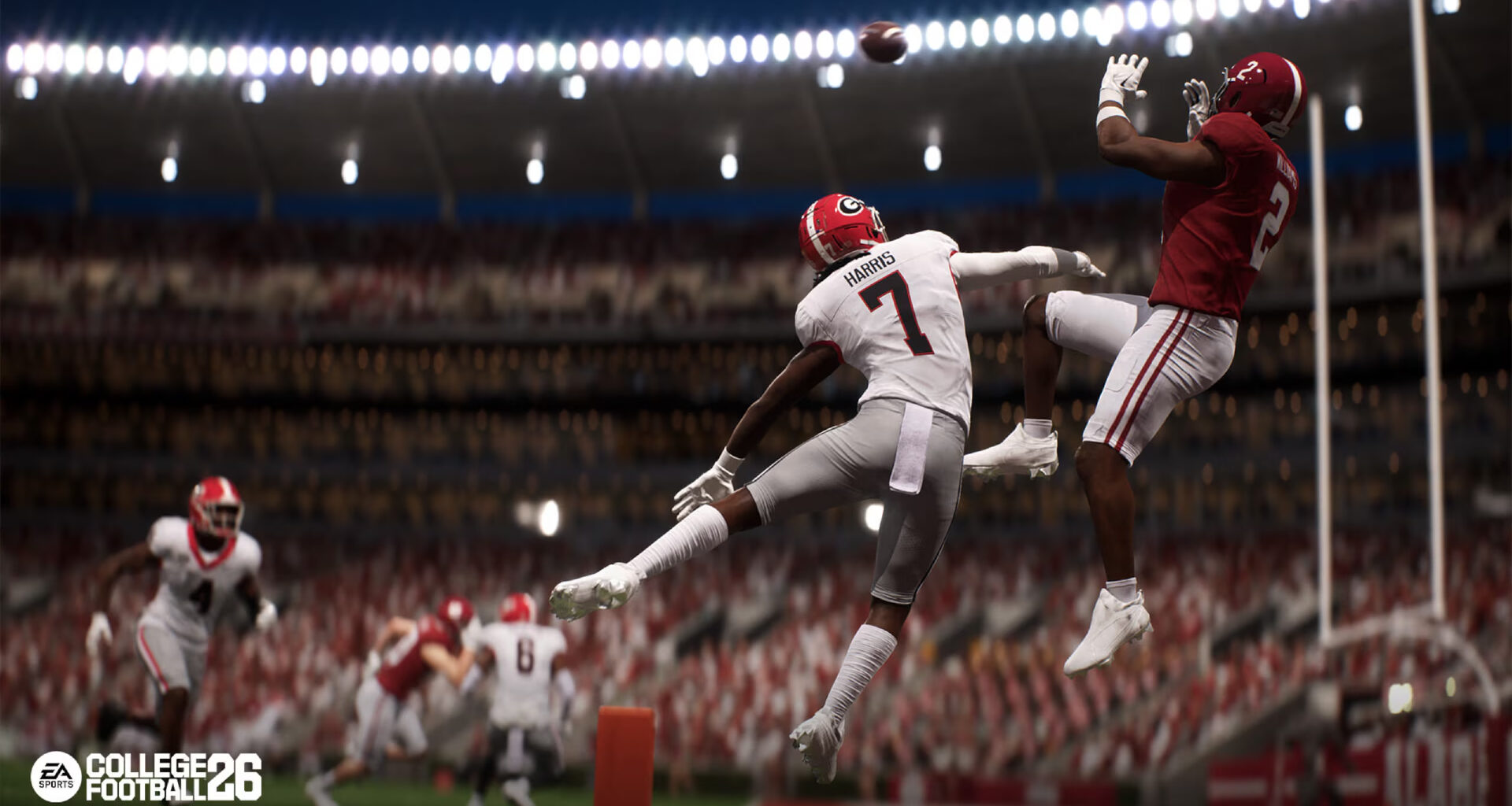 College Football 26: two players jumping in mid-air trying to catch a ball.