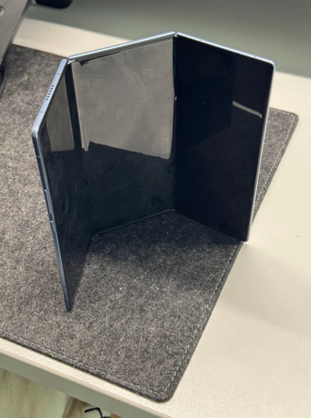 An alleged real life photo of the TECNO Ultimate G Fold concept foldable opened and standing.
