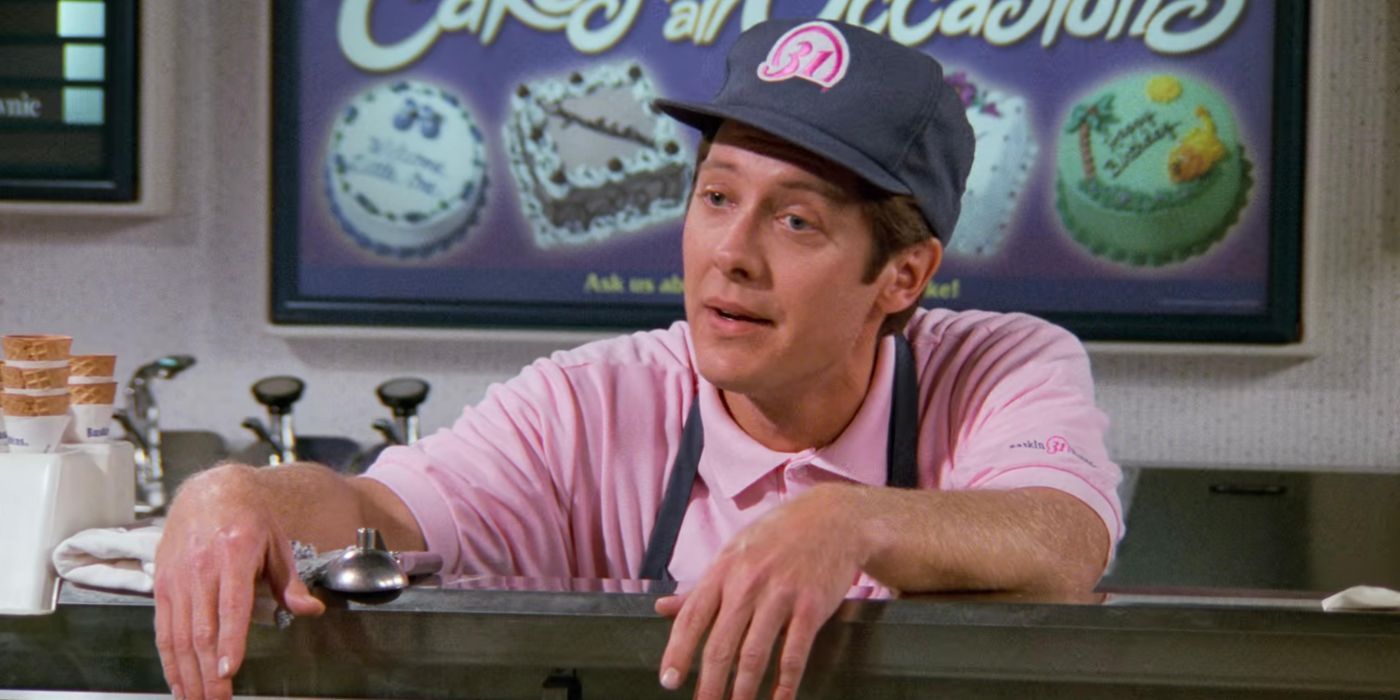 Jason Hanky (James Spader) leaning over the counter looking annoyed in Seinfeld.