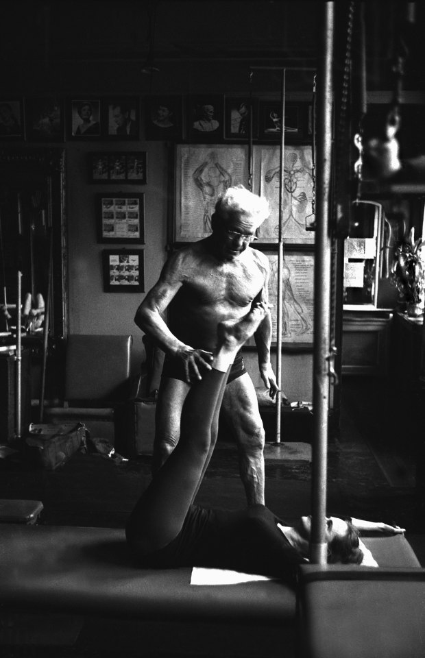 Joe Pilates instructing a client in his New York City studio.