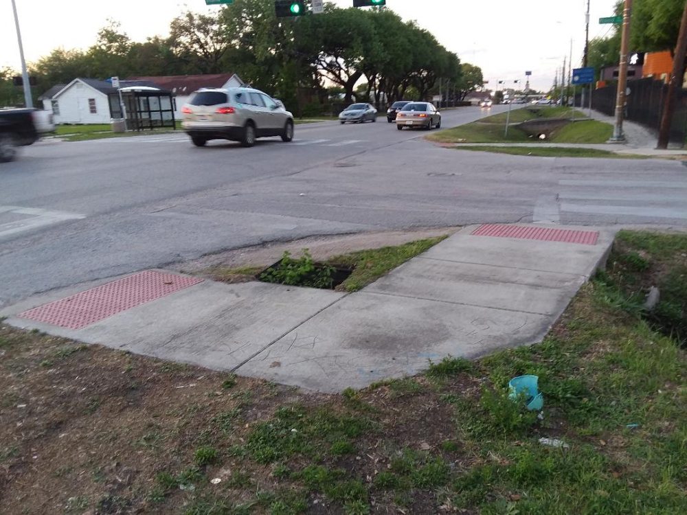 On the northeast corner of Lockwood at Rand Street there's a landing pad for pedestrians but it doesn't connect to a sidewalk. 