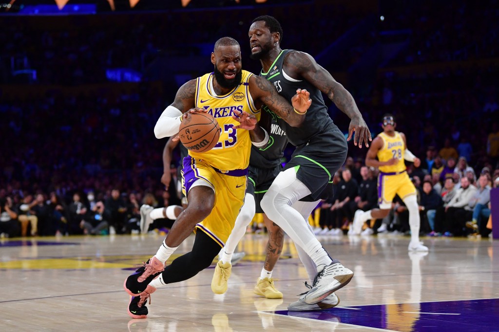Los Angeles Lakers forward LeBron James (23) moves to the basket against Minnesota Timberwolves forward Julius Randle (30) during the first half in game five of first round for the 2025 NBA Playoffs at Crypto.com Arena. 
