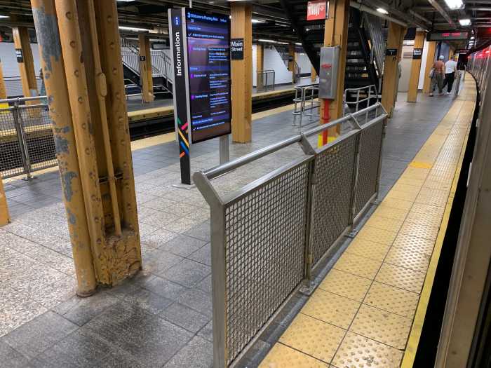 a subway station that a barrier on the platform edge