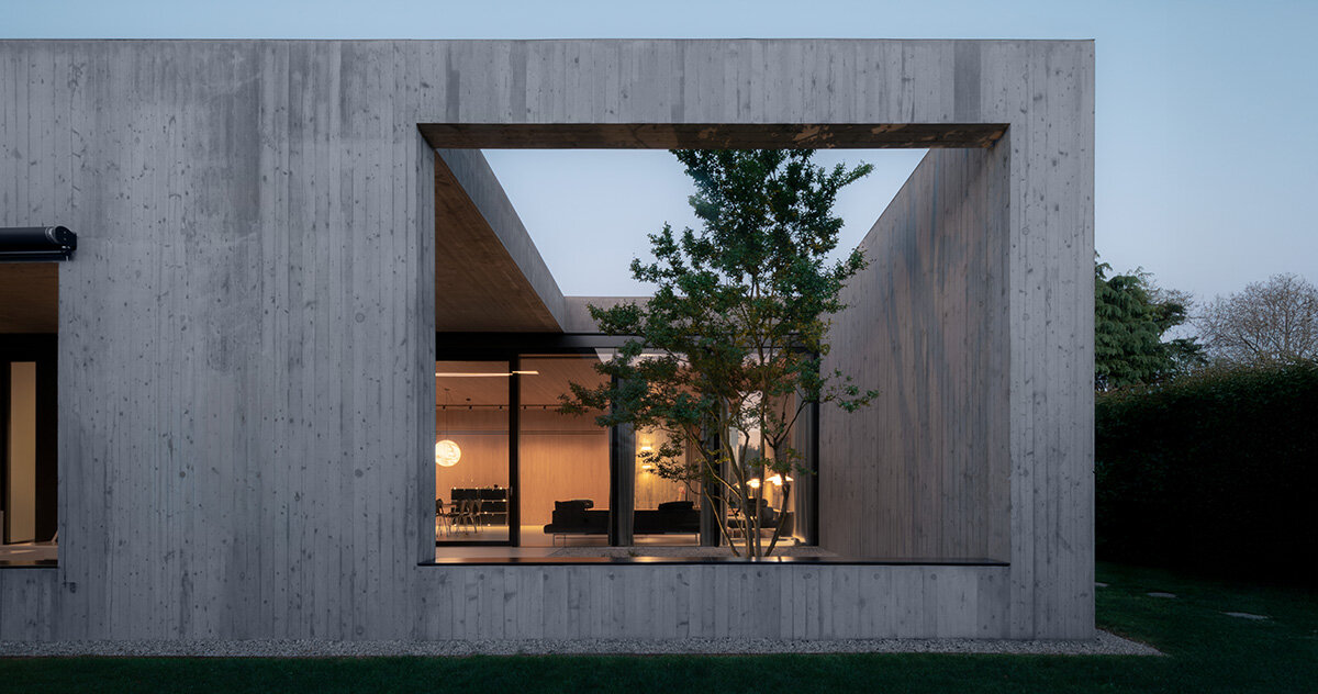 house by MIDE architetti integrates interior and landscape in italy