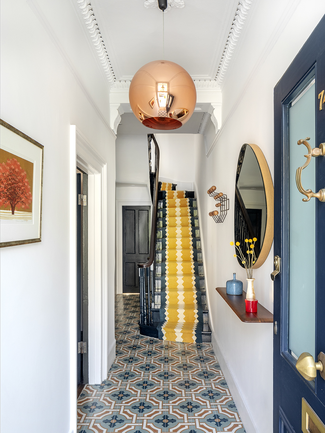 staircase with yellow runner