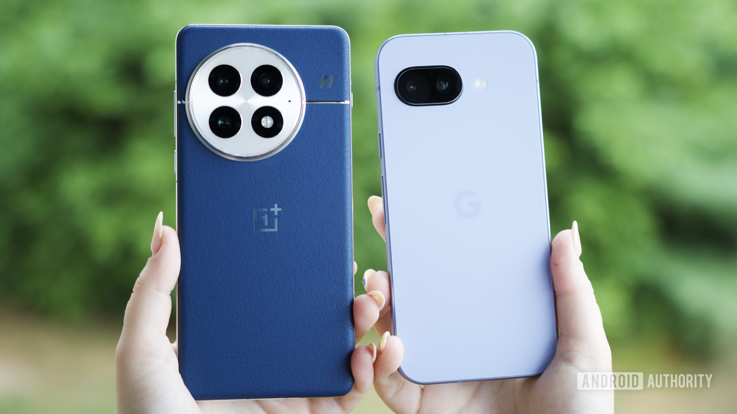 Someone holding a OnePlus 13 and Google Pixel 9a next to each other.