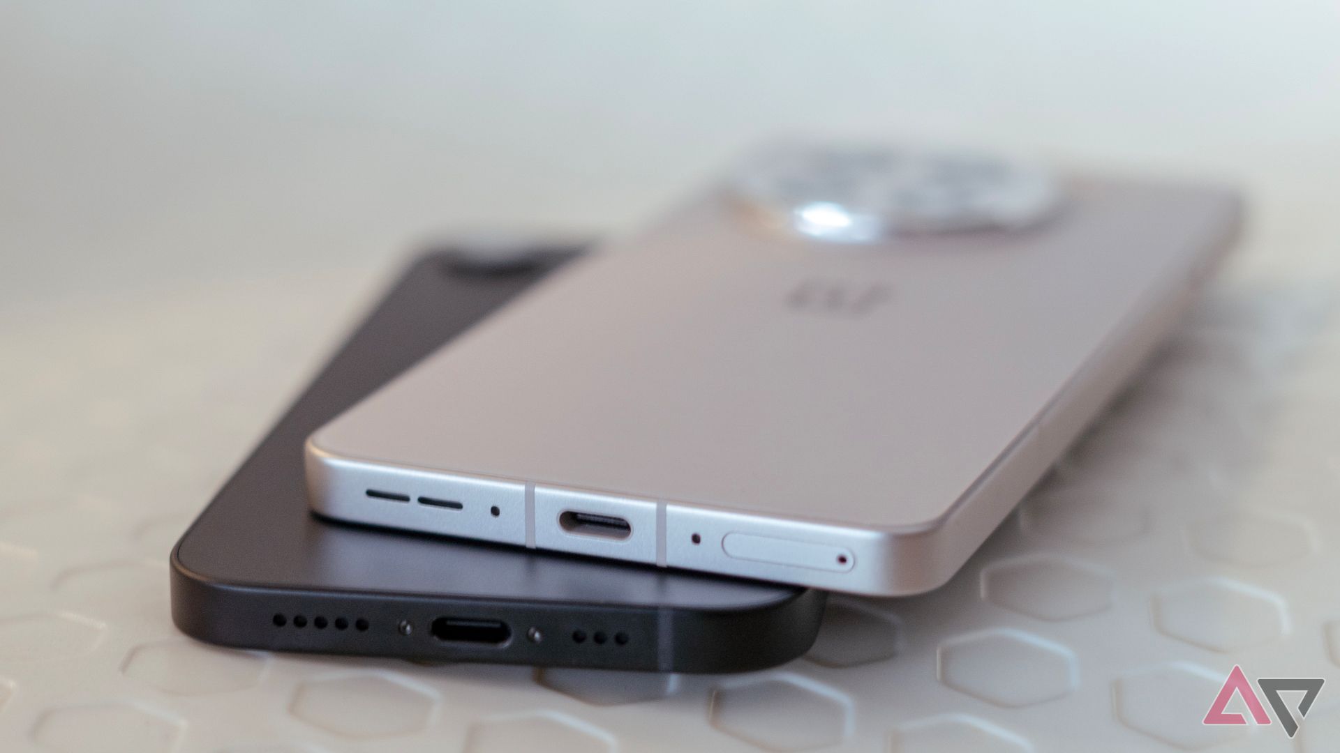 OnePlus 13R vs iPhone 16e showing USB-C charging ports