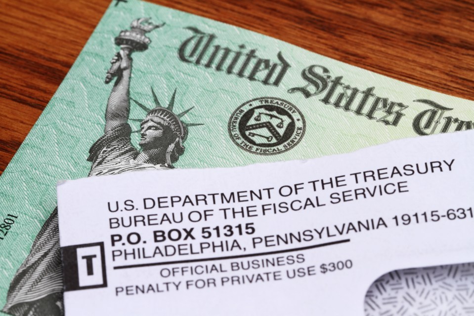 Opened envelope and U.S. Treasury check.