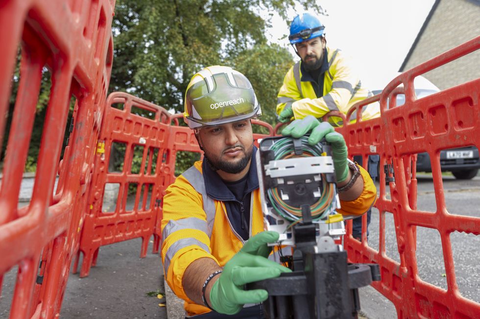 Openreach broadband engineer pictured working on fibre cable