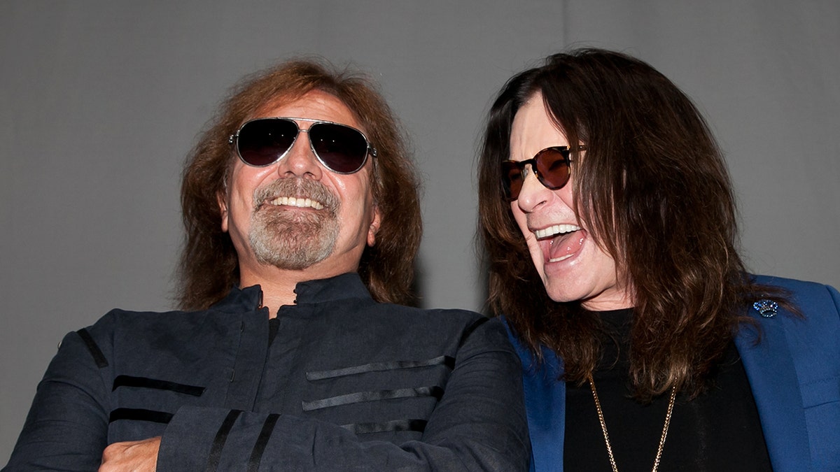 Ozzy Osbourne laughs with Black Sabbath bassist Geezer Butler.