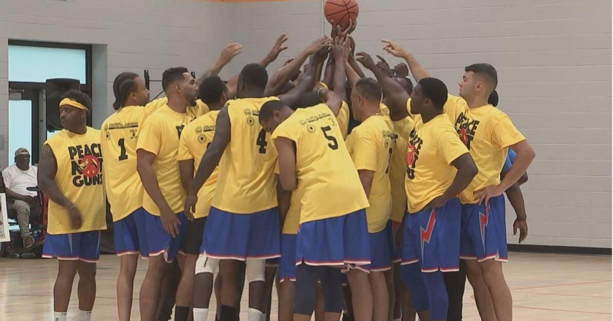 Philadelphia police, firefighters join anti-violence activists for "Peace Not Guns" basketball game