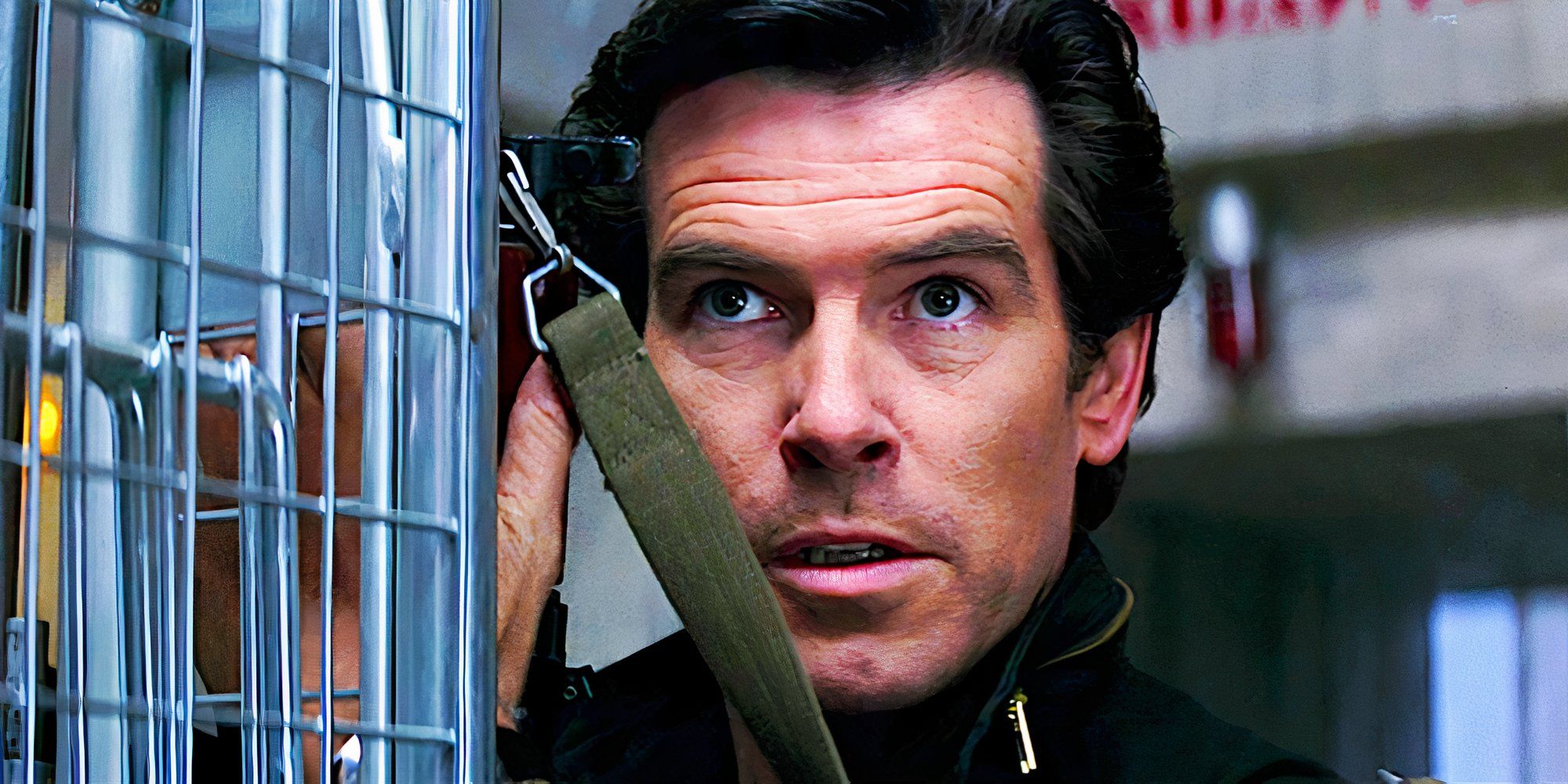 Pierce Brosnan looks up intensely in a scene from Goldeneye