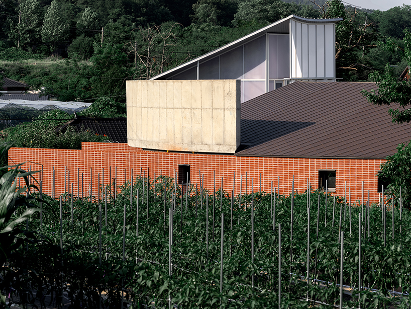 circular house by sukchulmok + BRBB encloses vegetable garden on korean farmland