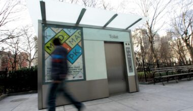 A pedestrian walks past one of the city's public toilets outside Madison Square Park. (AP /Mary Altaffer)