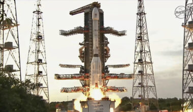 A white rocket with fat bottom lifts off