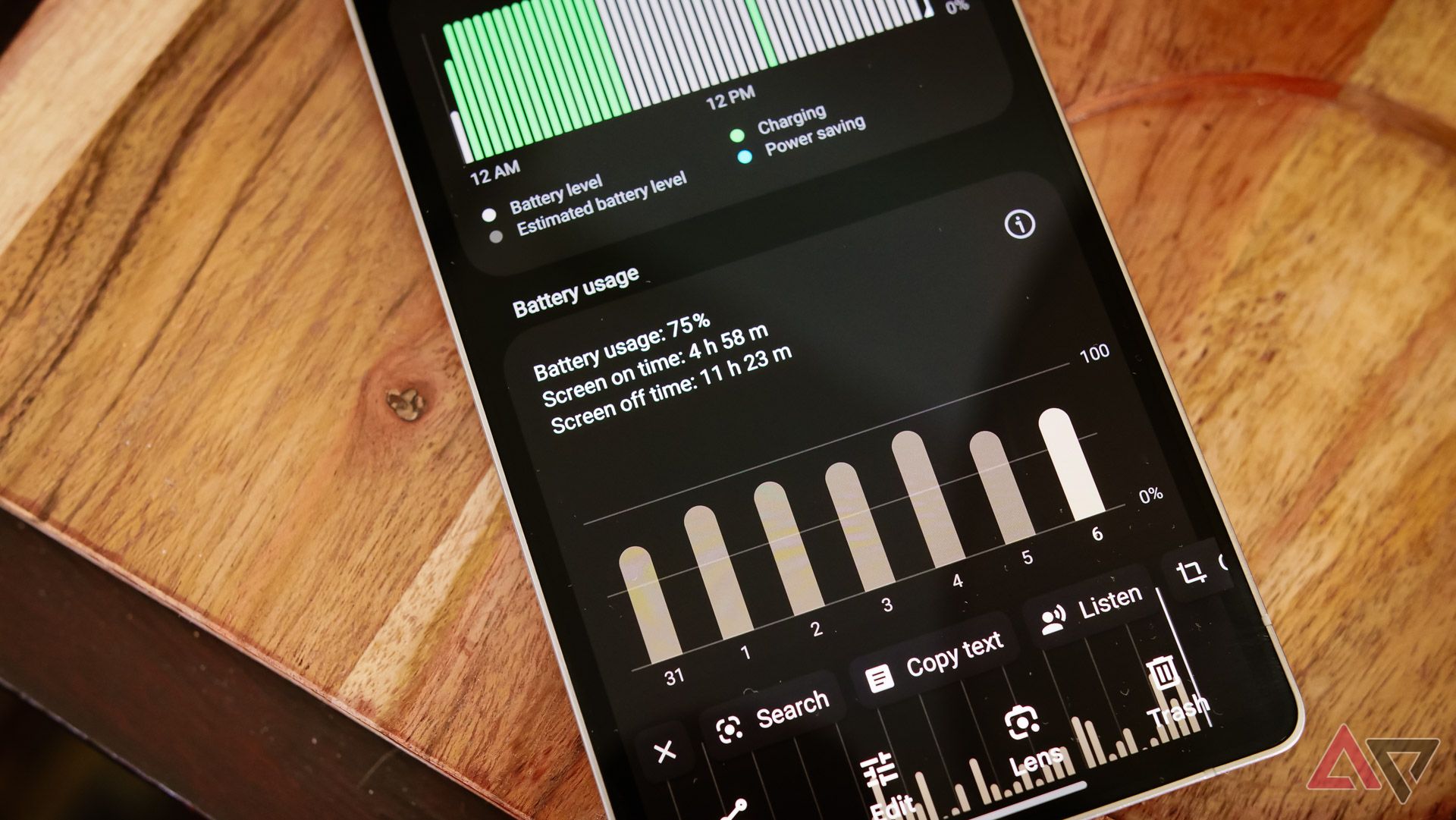 Battery results on a Galaxy S25 Ultra sitting on top of a wooden table.