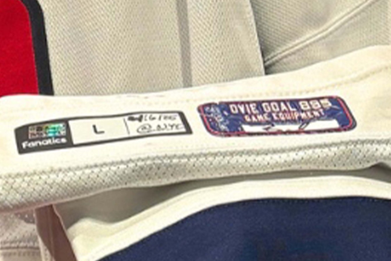 The labels on Ovechkin's sock at the Hockey Hall of Fame, including a Fanatics game-used gear sticker and an “Ovie Goal 895 Equipment” sticker