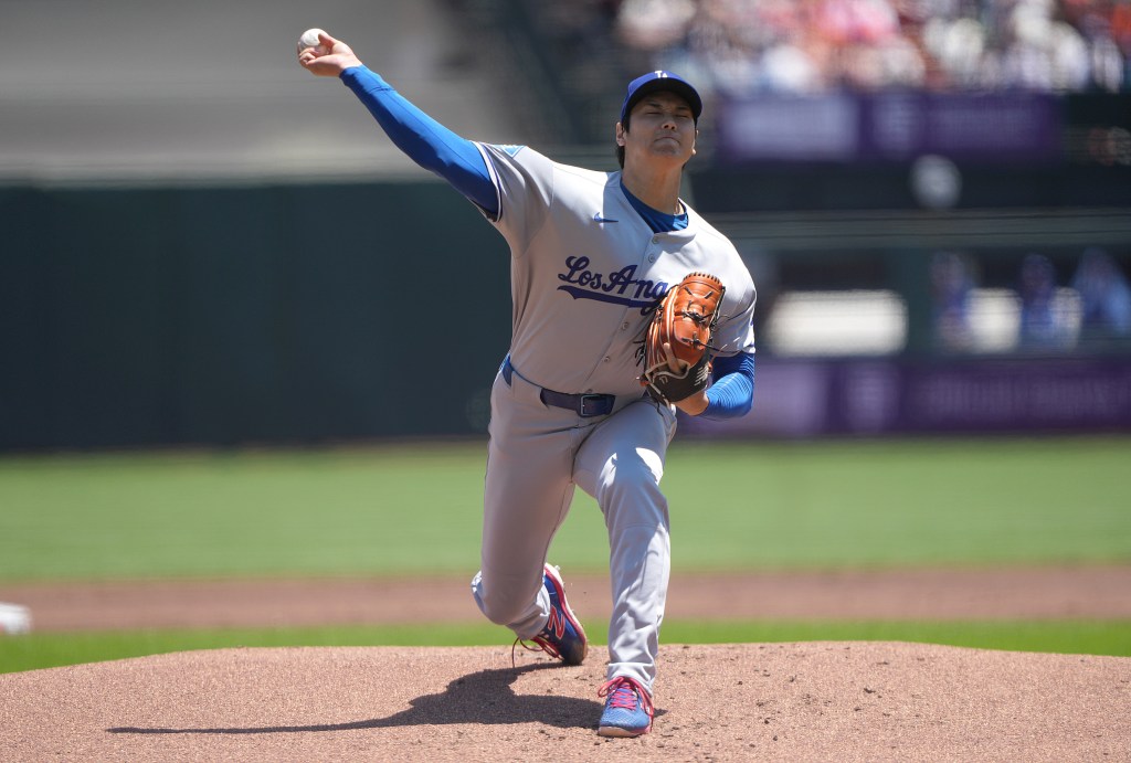 Los Angeles Dodgers pitcher throwing a baseball.