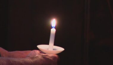 Dallas honors flood victims with candlelight vigil at Munger Place Church