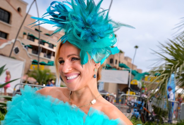 Melina Butuci of Encinitas proudly posed with her opening day hat. Butuci was among the competitors at the 31st annual Opening Day Hats Contest at the Del Mar Racetrack. (Nelvin C. Cepeda / The San Diego Union-Tribune)