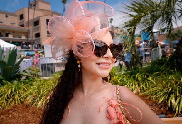 Edith Cantu of Chula Vista was among those wearing beautiful hats on opening day at the Del Mar Racetrack.(Nelvin C. Cepeda / The San Diego Union-Tribune)