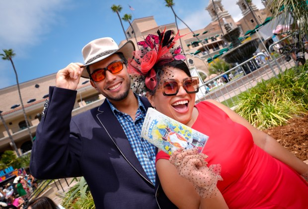 Angel Reydom of North Park and Amy Cordero of Huntington Beach were among those wearing beautiful hats on opening day at the Del Mar Racetrack.(Nelvin C. Cepeda / The San Diego Union-Tribune)