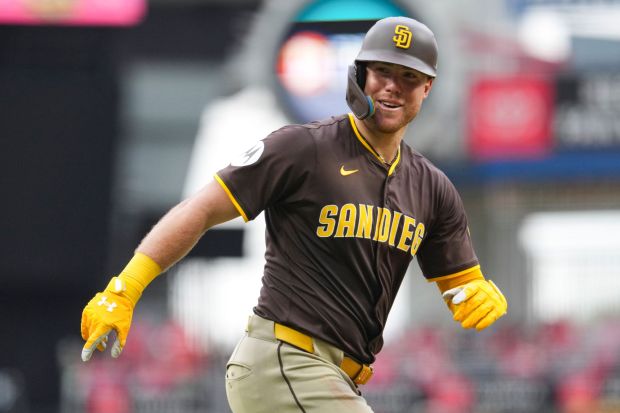 The Padres' Gavin Sheets rounds the bases after hitting a three-run homer in the seventh inning of Saturday's victory over the Reds. (AP Photo/Jeff Dean)