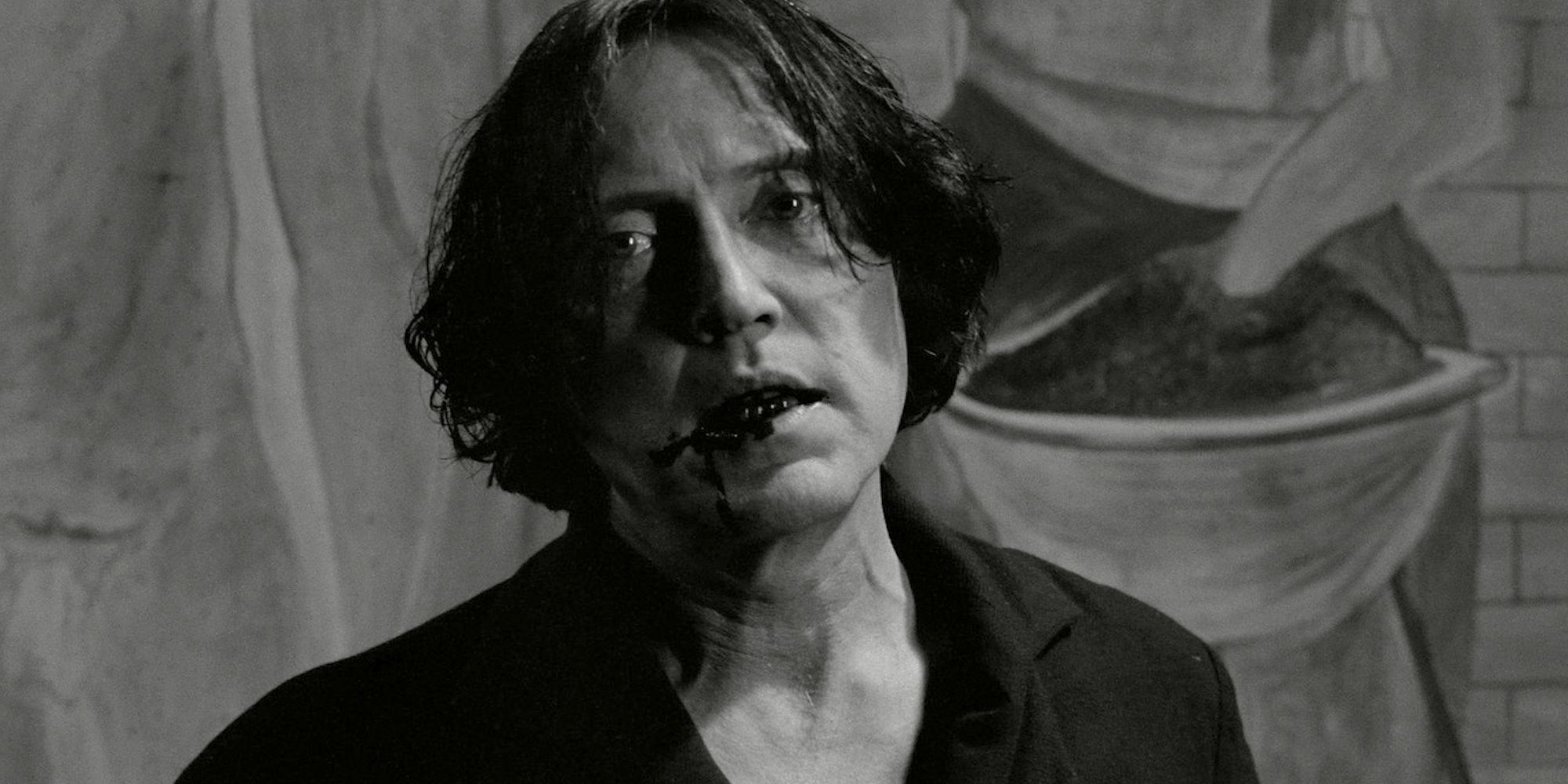 Christopher Walken has blood on the corner of his mouth in The Addiction.
