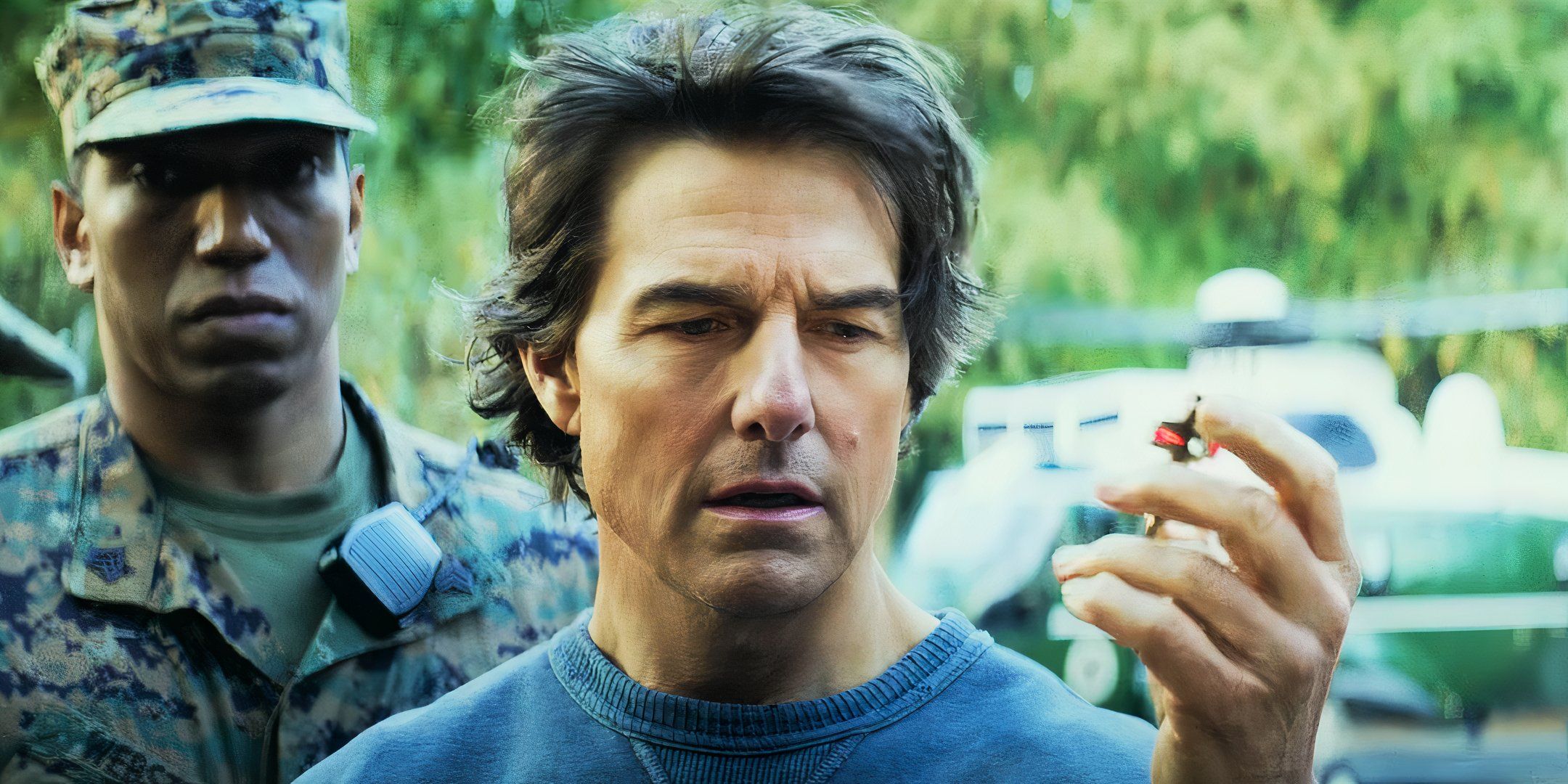 Tom Cruise as Ethan Hunt holding up a key in Mission: Impossible – The Final Reckoning