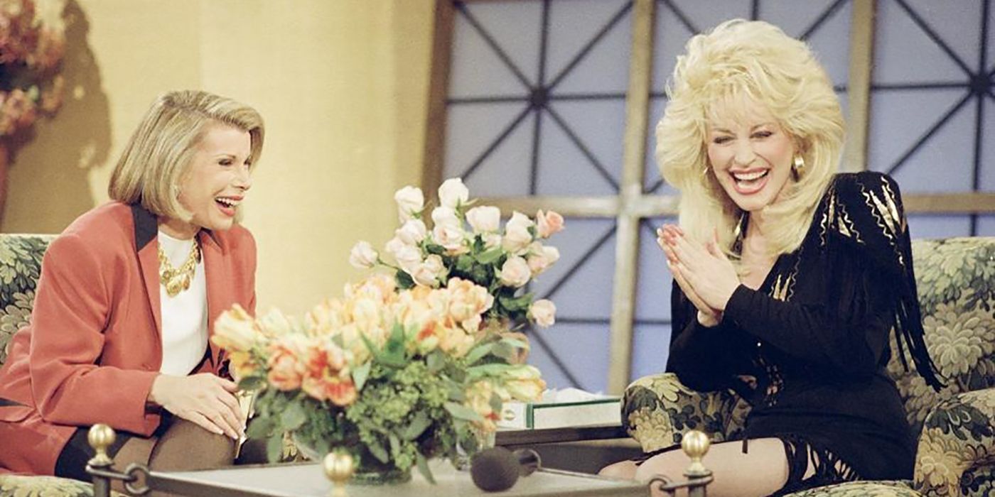Joan Rivers laughing with Dolly Parton on The Late Show with Joan Rivers.