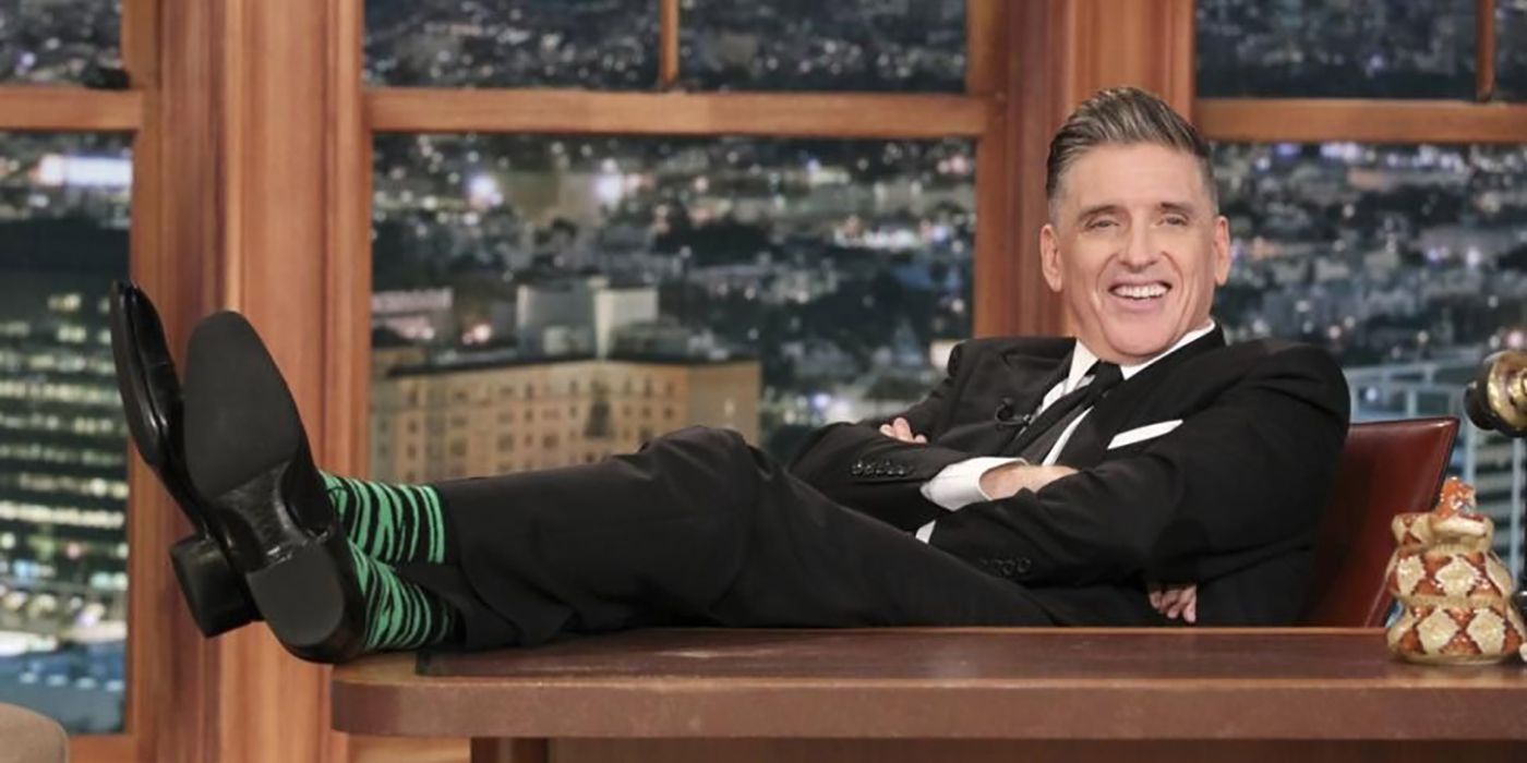 Craig Ferguson sitting behind his desk, legs on the desk in The Late Late Show with Craig Ferguson.