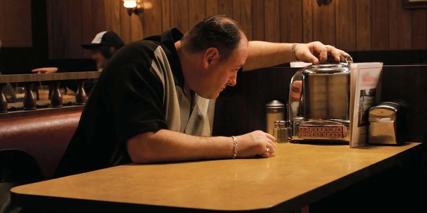 Tony (James Gandolfini) sitting at a diner, waiting to be joined by his family, in The Sopranos finale, "Made in America."