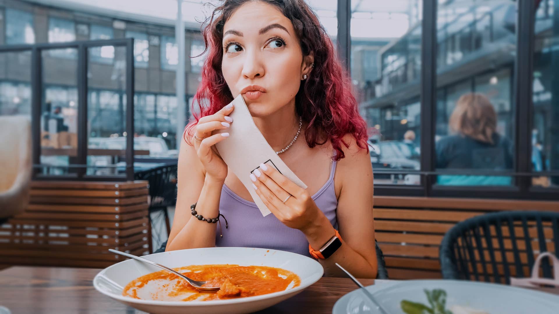 woman using paper napkin