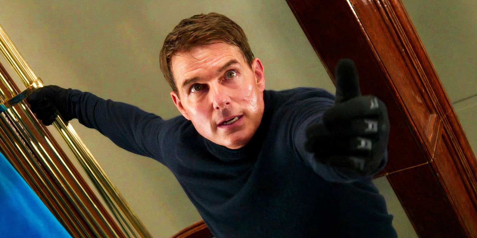 Tom Cruise holding out his hand as Ethan Hunt in Mission Impossible Dead Reckoning-1