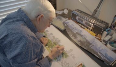 Beloved artist Phil Ponder is working on his latest Nashville skyline painting
