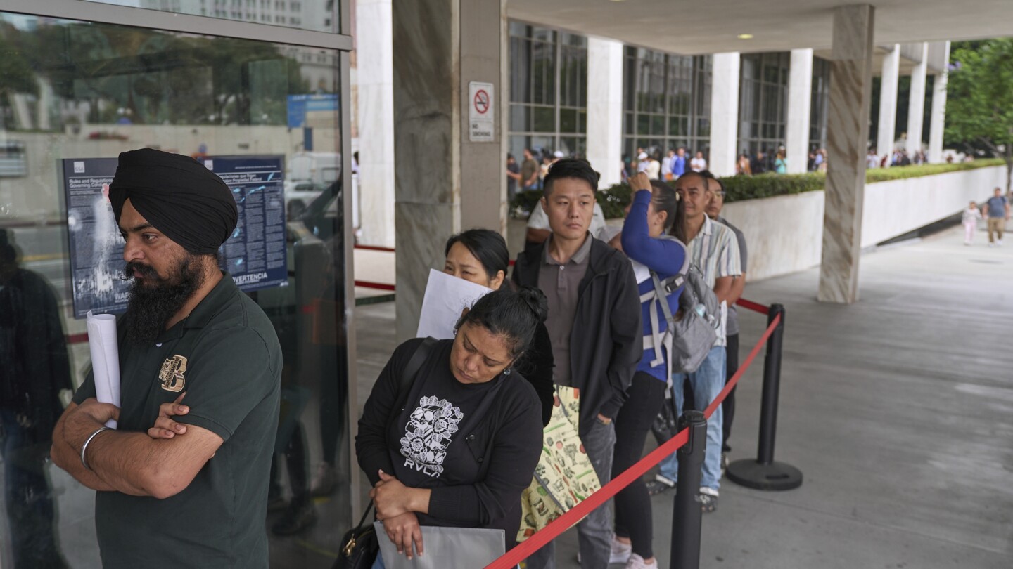 Families seek answers as they wait outside an LA immigration center