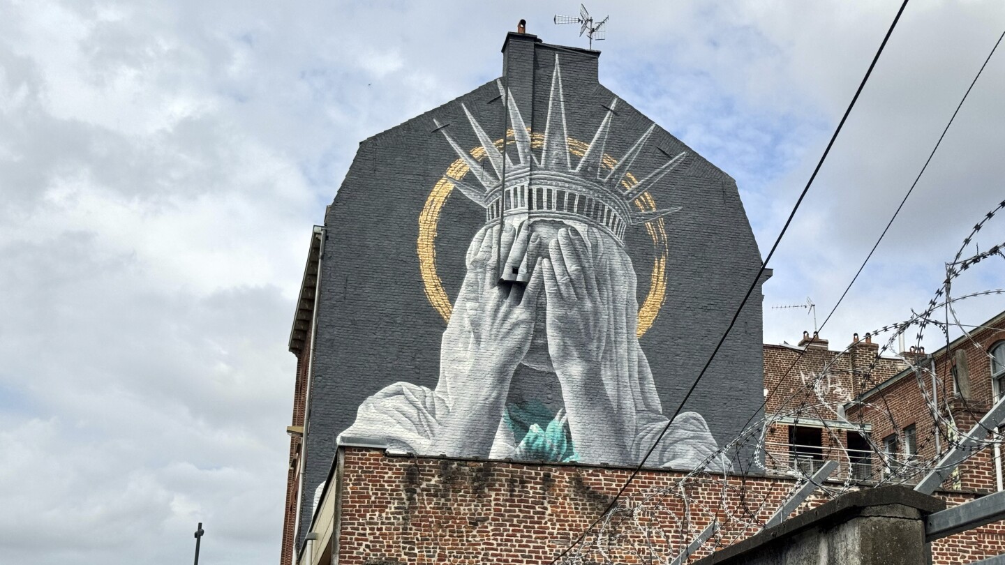 A new mural in France shows the Statue of Liberty covering her eyes