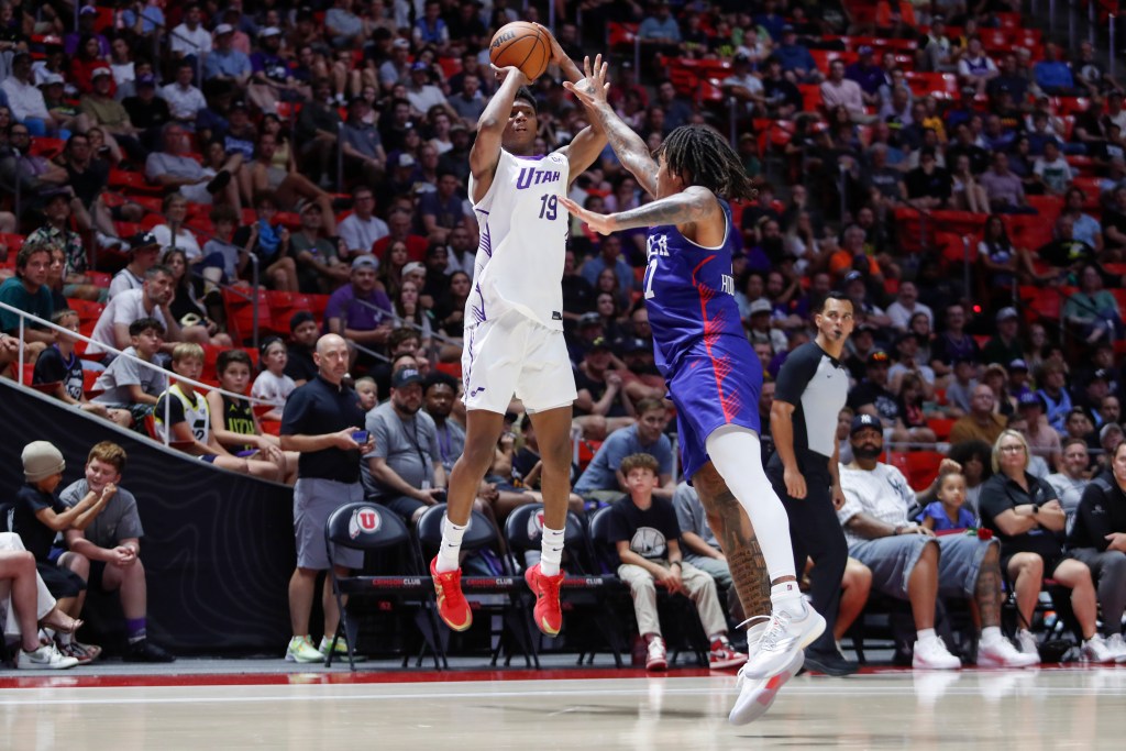 Utah Jazz's Ace Bailey (#19) shoots over Philadelphia 76ers' Jalen Hood-Schifino (#17) during an NBA Summer League game.