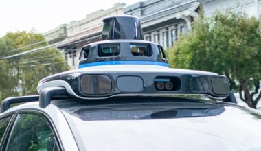 A Waymo self-driving car is seen in the Inner Richmond neighborhood of San Francisco, California, with the Lidar unit on the vehicle visible, November 17, 2024.