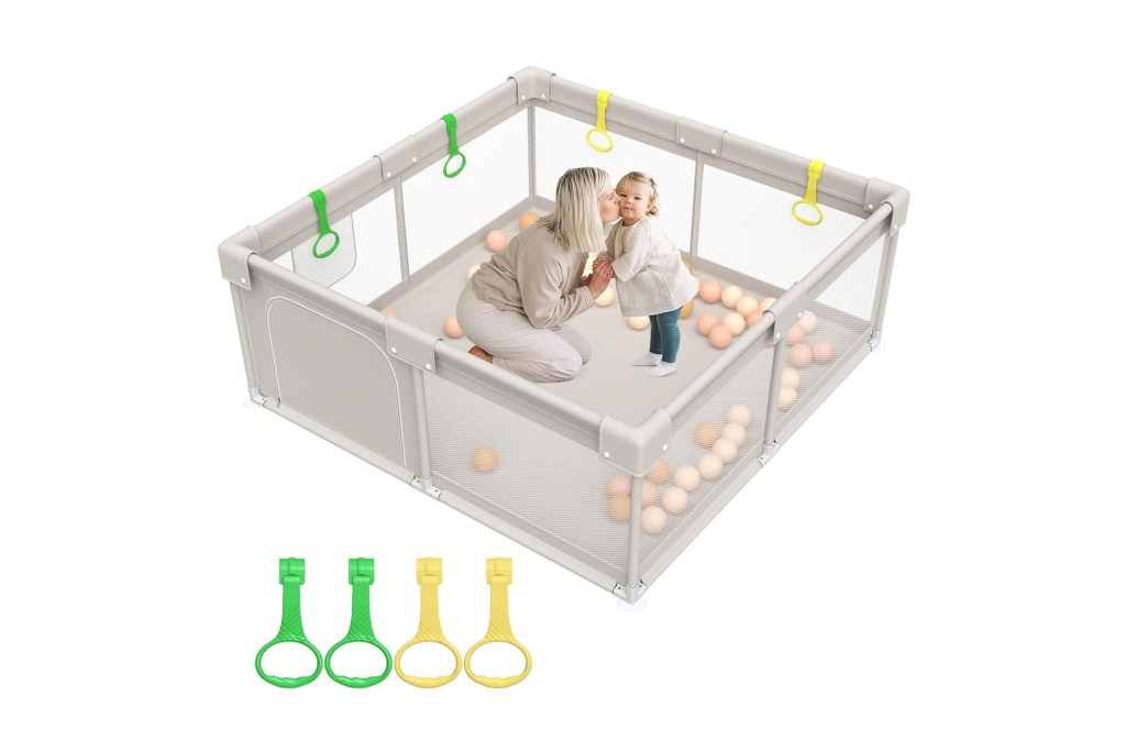 A woman and a child playing in a playpen