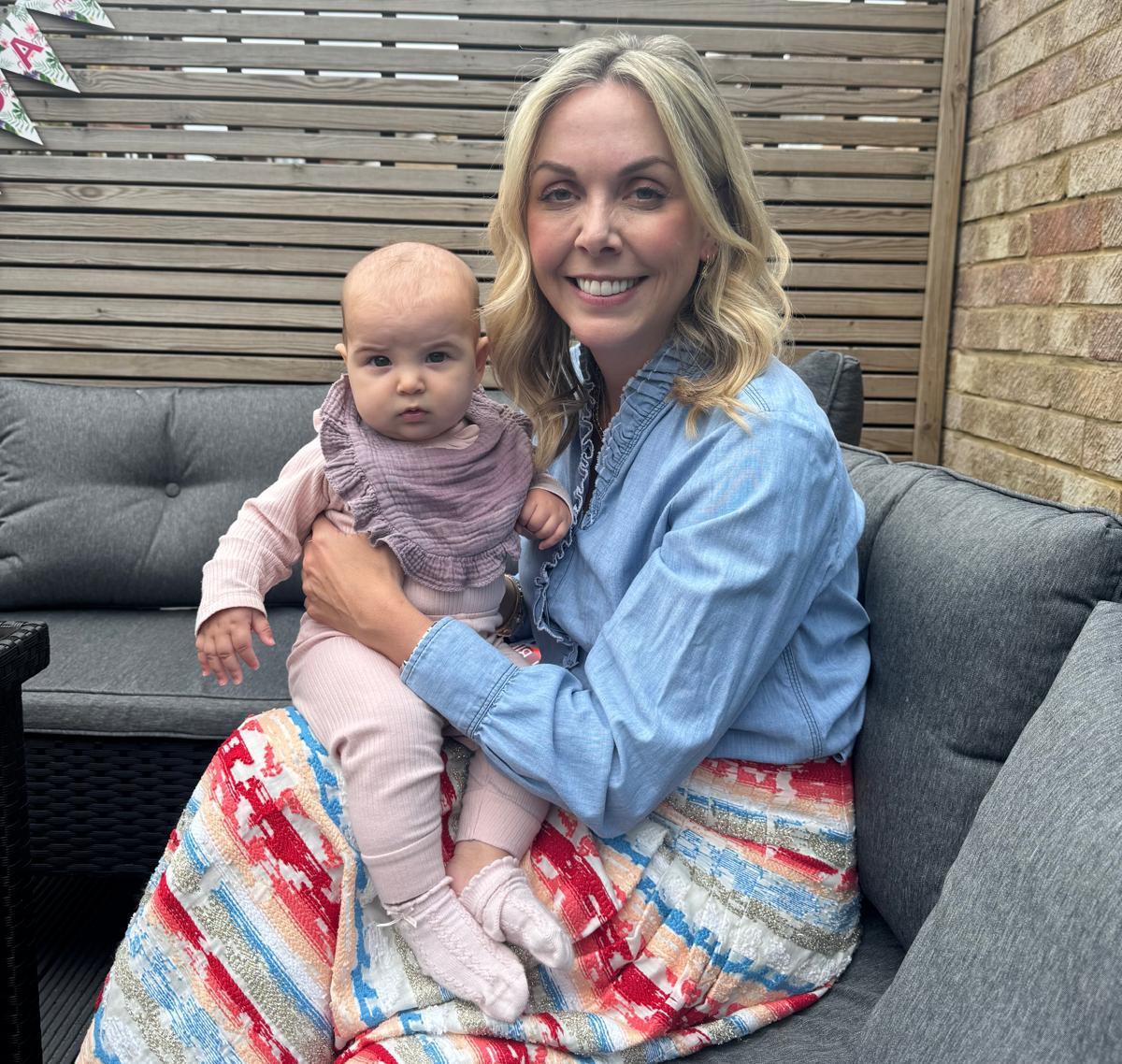 Holly Stevens holding her daughter Violet.