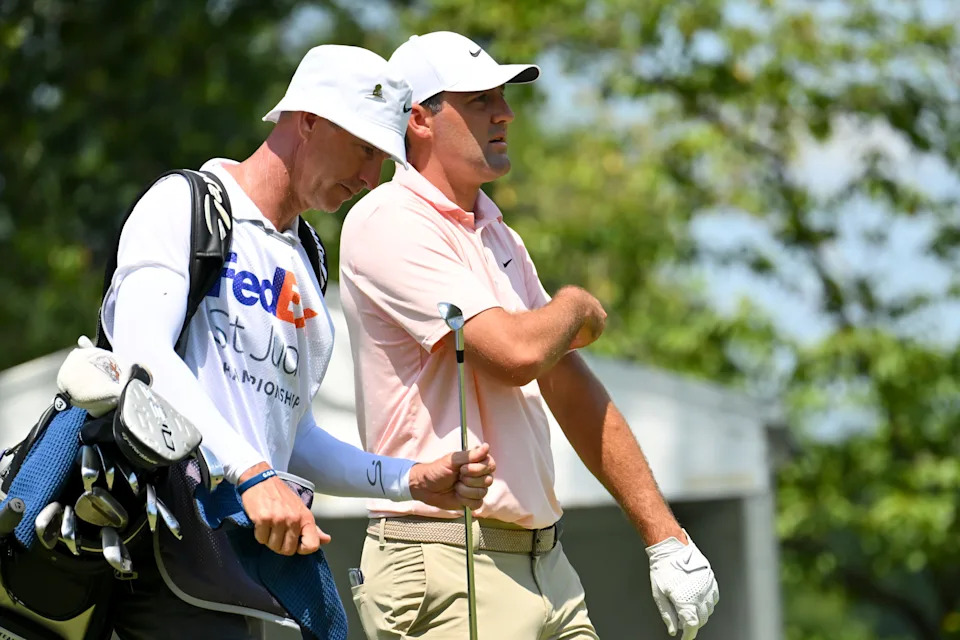 Scottie Scheffler walks down the eighth fairway during the first round of the FedEx St. Jude Championship golf tournament.