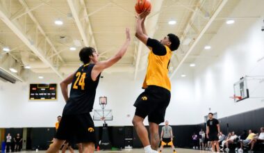 Iowa’s Kael Combs (11) shoots over Tate Sage (24) during practice June 19, 2025 at Carver-Hawkeye Arena in Iowa City, Iowa.