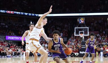 Feb 8, 2025; Ames, Iowa, USA; Iowa State Cyclones center JT Rock (30) defends TCU Horned Frogs guard Noah Reynolds (21) during the second half at James H. Hilton Coliseum. Mandatory Credit: Reese Strickland-Imagn Images