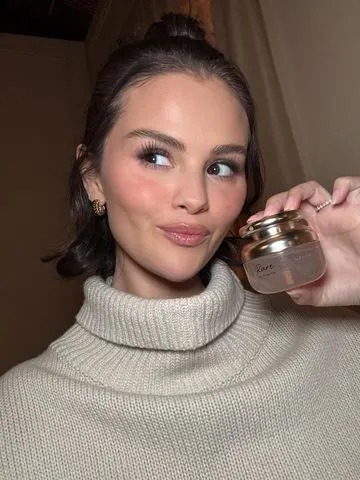 Instagram/@selenagomez Selena Gomez holding Rare Eau de Parfum.
